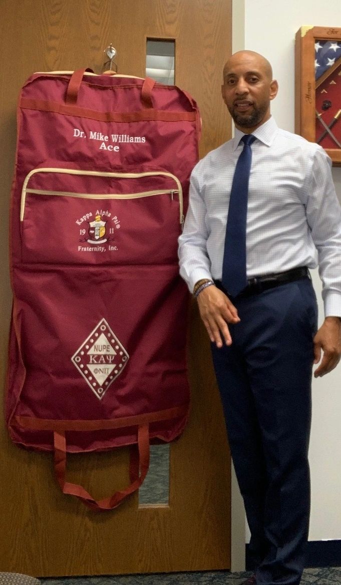 Crimson garment bag with cream trim